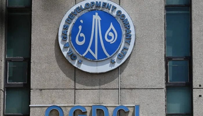 The logo of the Oil and Gas Development Company (OGDCL) is pictured at the facade of their headquarters in Islamabad. — AFP/File