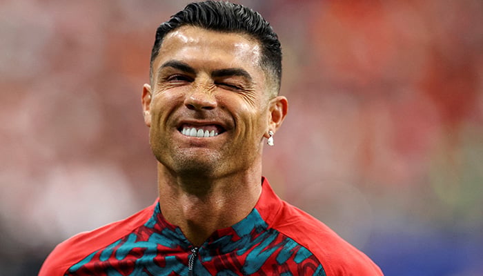 Portugals Cristiano Ronaldo winks during the warm up before the match. — Reuters/File