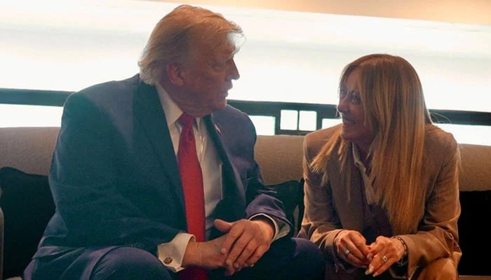 US President Donald Trump speaks to Italian Prime Minister Giorgia Meloni on the sidelines of the G7 Summit in Evian-les-Bains, France, June 17, 2026. — Reuters