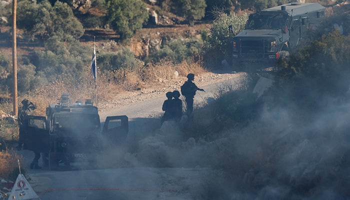 Israeli soldiers operate amid a Palestinian protest against a new Israeli settlement in the West Bank village of Deir Abu Mishal, near Ramallah, in the Israeli-occupied West Bank, June 13, 2026. — Reuters