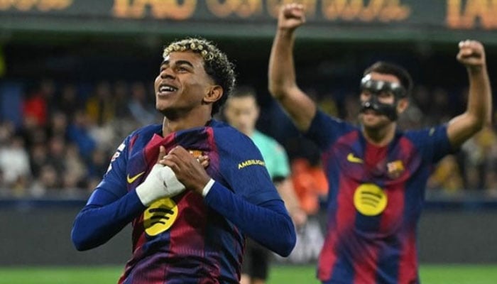 Barcelonas Spanish forward Lamine Yamal celebrates scoring his teams second goal during the Spanish league football match between Villarreal CF and FC Barcelona at La Ceramica Stadium in Vila-real on December 21, 2025. —AFP
