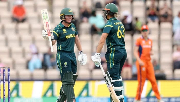 Australias Beth Mooney (left) celebrates scoring her half-century with teammate Ashleigh Gardner during their ICC Womens T20 World Cup match against Netherlands at The Rose Bowl in Southampton on June 20, 2026. — ICC