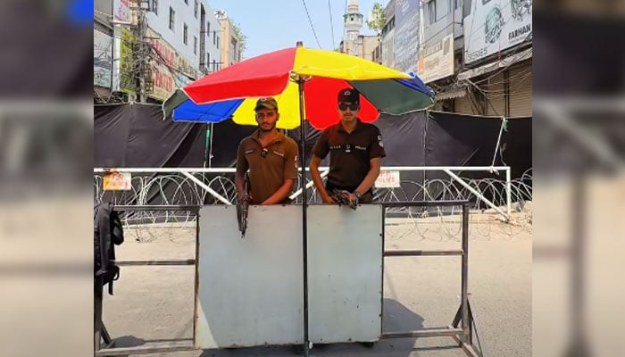 Punjab Police personnel standing guard on the road for the mourning processions and Majalis in the city on June 21, 2026. — Screengrab via Facebook@LahorePoliceOperationsWing