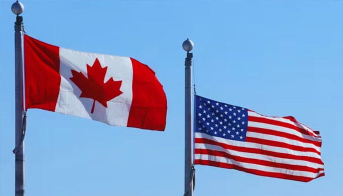The representational image shows the flags of Canada (left) and the United States. —AFP/File