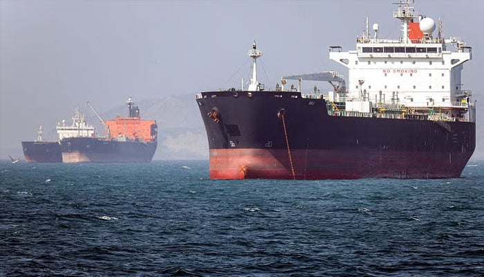 Tankers sail in the Gulf, near the Strait of Hormuz, as seen from northern Ras al-Khaimah, near the border with Oman’s Musandam governance, amid the U.S.-Israeli conflict with Iran, in the United Arab Emirates, March 11, 2026. — Reuters