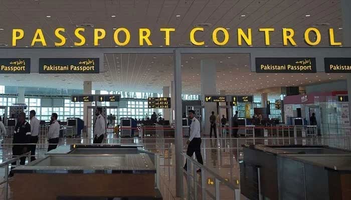 Airport staff walks through the Islamabad International Airport on April 26, 2018. — AFP