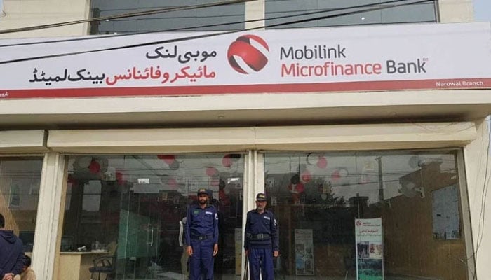 Security guards standing alert outside Mobilink Microfinance Bank Narowal branch. — Facebook@MobilinkMicrofinanceBankLimited/File