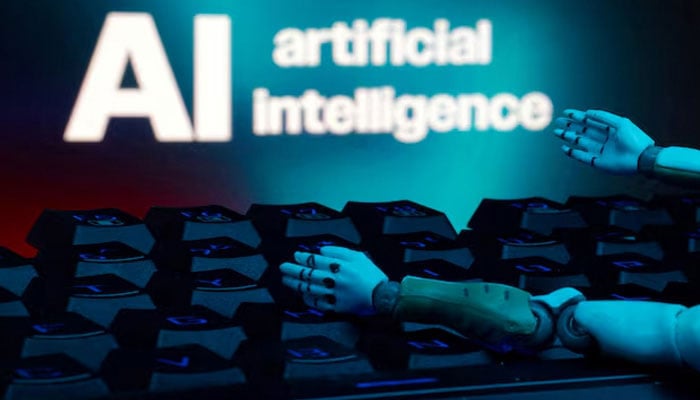 A message reading AI artificial intelligence, a keyboard, and robot hands are seen in this illustration taken January 27, 2025. — Reuters