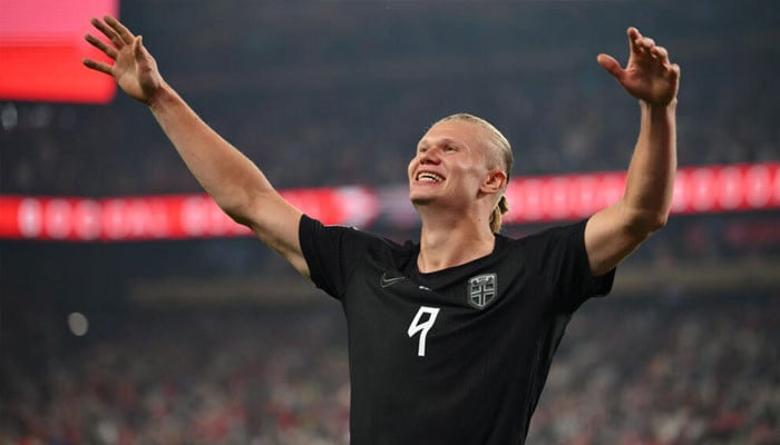 Erling Haaland can be seen celebrating. —AFP/File