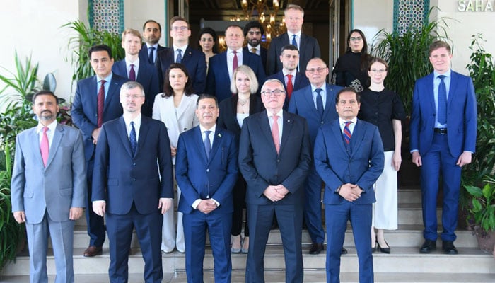 Additional Secretary (Ministry of Foreign Affairs) Ambassador Muhammad Khalid Khan Jamali and Russian Federation Deputy Minister for Foreign Affairs Mr. Dmitry Lyubinsky, along with other members, posing for the photo after meeting, June 23, 2026. —Facebook@foreignofficepk
