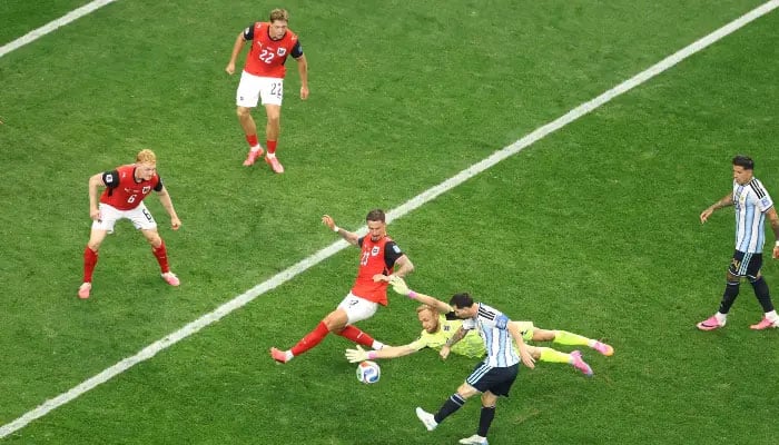 Lionel Messi #10 of Argentina shoots while Marco Friedl #23 of Austria blocks during the FIFA World Cup 2026 Group J match between Argentina and Austria at Dallas Stadium on June 22, 2026, in Arlington, Texas. — AFP