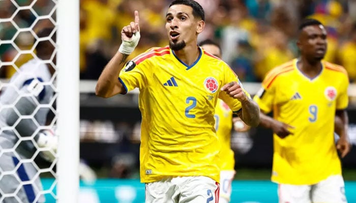 Colombia defender Daniel Munoz celebrates scoring against DR Congo in World Cup Group K. — AFP/File