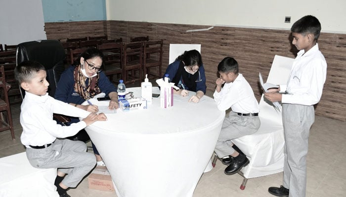 Health staff examine children during a Community Health & Wellness Medical Camp at Pakistan Sweet Home, organised by the Maroof International Hospital (MIH), in collaboration with the Royal Thai Embassy on June 23, 2026. —  Facebook@thai.islamabad