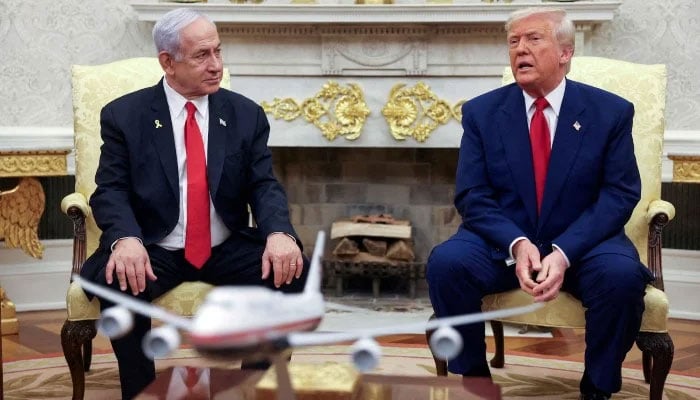 US President Donald Trump talks to Israeli Prime Minister Benjamin Netanyahu during a meeting where Trump announced nuclear talks with Iran, Washington, US, April 7, 2025. — Reuters