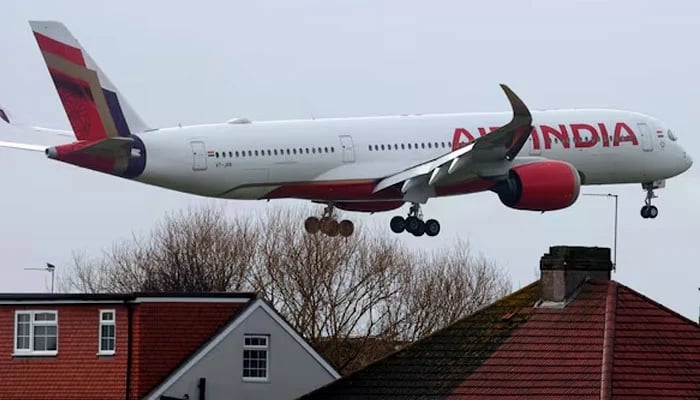 An Air India passenger plane flies near houses as it makes its landing approach to Heathrow Airport in west London, Britain, January 28, 2025. — Reuters/File