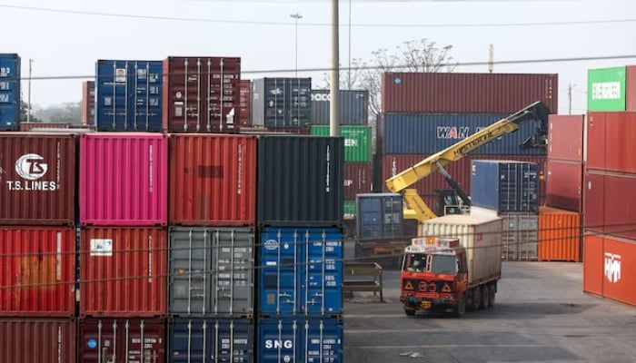 A person drives a truck inside a shipping container yard in Navi Mumbai, India, February 4, 2026. — Reuters