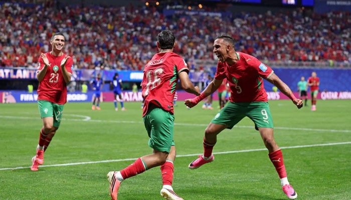 Gessime Yassine #16 of Morocco celebrates with teammate Soufiane Rahimi #9 and Bilal El Khannouss #23 after scoring his team´s fourth goal during the FIFA World Cup 2026 Group C match between Morocco and Haiti at Atlanta Stadium on June 24, 2026 in Atlanta, Georgia. — AFP
