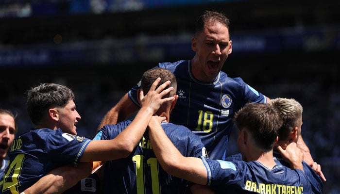 Bosnia and Herzegovina players celebrate after an own goal by Sultan Albrake #18 of Qatar for the teams second goal during the FIFA World Cup 2026 Group B match between Bosnia and Herzegovina and Qatar at Seattle Stadium on June 24, 2026 in Seattle, Washington. — AFP