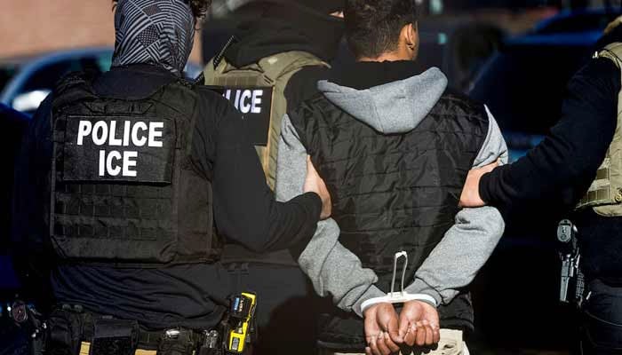 Immigration and Customs Enforcement agents detain a man after conducting a raid at the Cedar Run apartment complex in Denver, Colorado, US, February 5, 2025.— Reuters