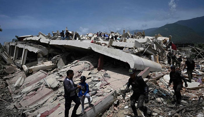 Search and rescue workers move across the rubble of a collapsed building in Los Corales, La Guaira state, about 38 km northwest of Caracas, on June 25, 2026. — AFP