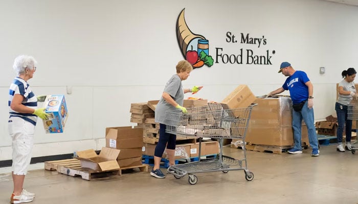 Volunteers assemble food boxes during a daily food distribution at St. Marys Food Bank in Phoenix, U.S. May 29, 2026. — Reuters