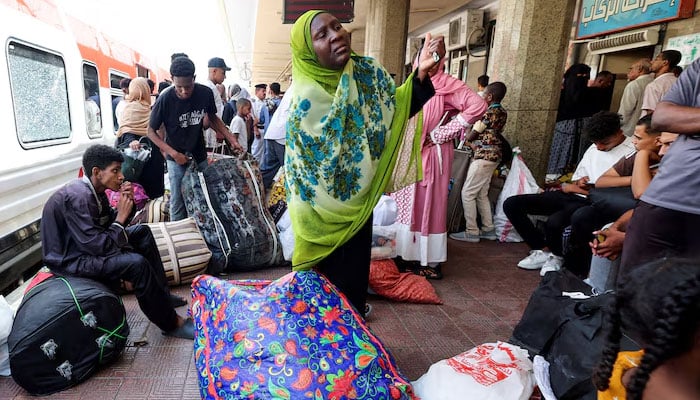 People gather at a train station, as Sudanese refugees crowd at Cairos main station to board a free train with a voluntary return coordinated by the Egyptian government to Aswan, where buses will take them home to Khartoum, in Cairo, Egypt, July 28, 2025. — Reuters