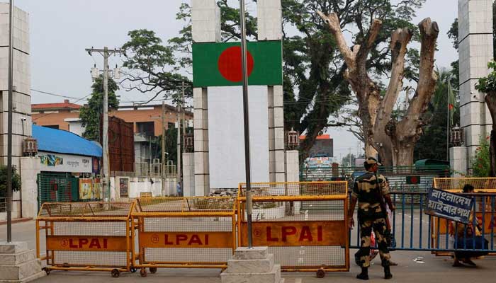 A Border Security Force (BSF) official stands in front of the gates of the India-Bangladesh international border in Petrapole, India, October 16, 2024. — Reuters