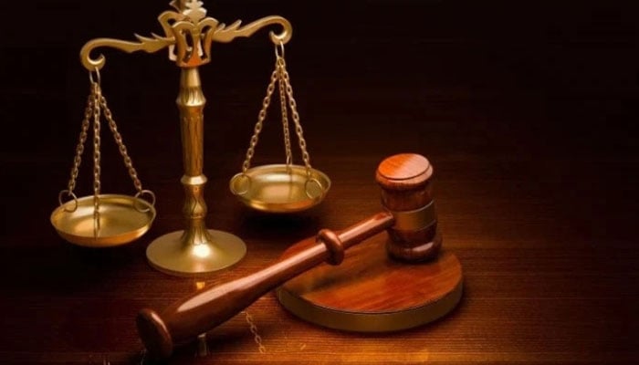 A representational image of scales of justice and a gavel. — Unsplash/File
