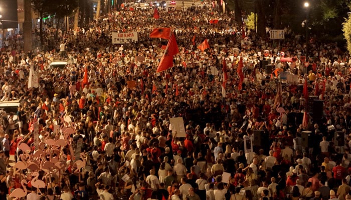 This aerial photograph shows people demonstrating in front of Albania’s Prime Minister’s office against a planned resort linked to US President’s family, in Tirana on June 27, 2026.—AFP