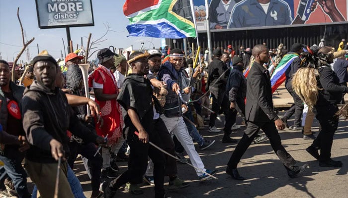 Protesters take part during a march against undocumented migrants organised by March in March movement in Soweto on June 29, 2026.—Reuters