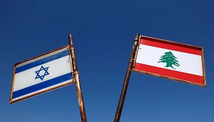 Representations of the Israeli and Lebanese flags at a memorial near the Israel-Lebanon border, outside Metula, Israel on June 27, 2026. — Reuters