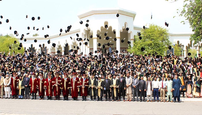 Chairman Senate, Syed Yousaf Raza Gilani pose for a photo with the students of Ghulam Ishaq Khan Institute (GIKI) in the Topi area of Swabi during the 30th Annual Convocation on June 30, 2026. — INP