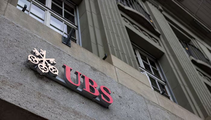 The UBS logo is pictured on a building next to the Federal Palace of Switzerland, in Bern, Switzerland, December 11, 2025.—Reuters