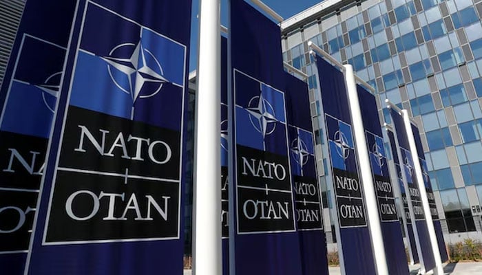 Banners displaying the NATO logo are placed at the entrance of new NATO headquarters during the move to the new building, in Brussels, Belgium April 19, 2018.—Reuters