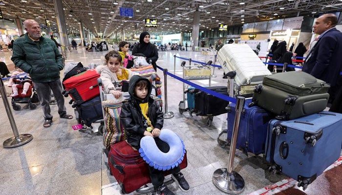 Displaced Lebanese, who had fled to Iraq, stand in a queue as they prepare to head back home after a ceasefire between Israel and Hezbollah took effect, in Najaf, Iraq, November 28, 2024. — Reuters
