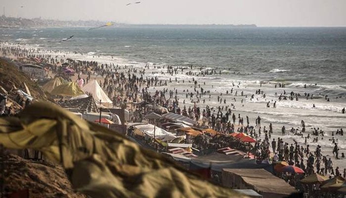 Palestinians gather along on the beach front in Gaza City on July 3, 2026.—AFP