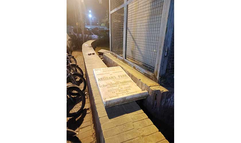 The brass plaque of Artisans’ Park, lying on the roadside, perfectly mirrors the way the memory of that park has faded. — Photos: Supplied