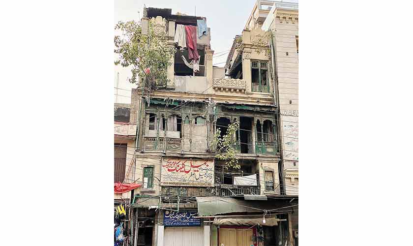 An old building with typical wooden balconies now at the verge of collapse in Gawalmandi area of Lahore.
