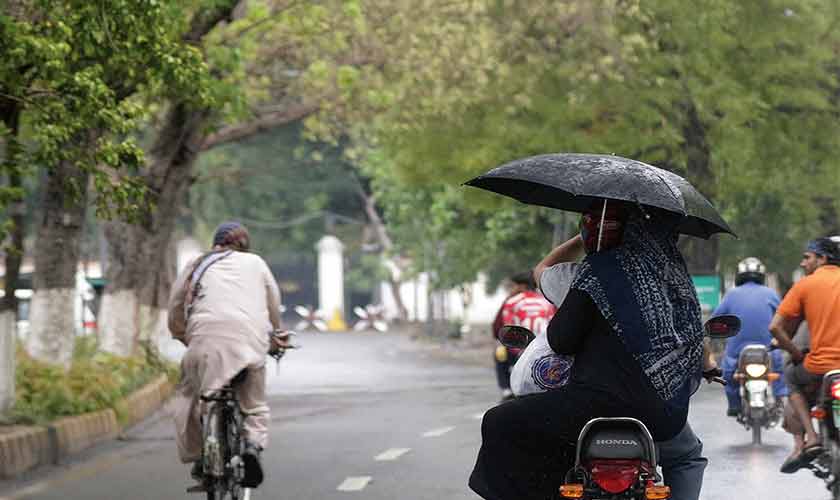 We are a people living between umbrellas and air conditioners, waiting for a forecast that might never arrive. — Photos by Rahat Dar