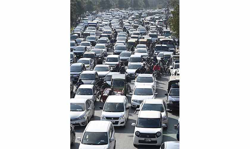 On several roads in the city traffic pressure remains unrelenting throughout the day. — Photos by Rahat Dar