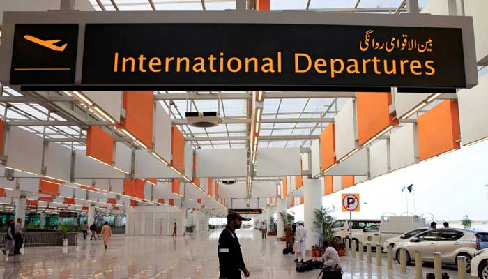 A worker walks at the departure area of the newly built Islamabad International Airport. — Reuters/File