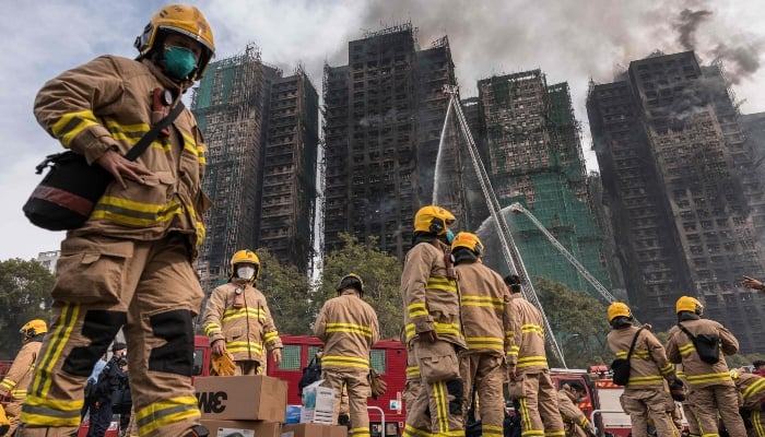 Firemen get ready after a major fire swept through several apartment blocks at the Wang Fuk Court residential estate in Hong Kongs Tai Po district on November 27, 2025. — AFP