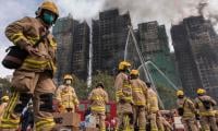 Over 50 dead, 250 missing after Hong Kong's deadliest blaze in decades