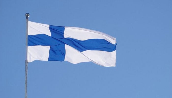 The Finnish flag flutters outside the city hall, as Finland becomes a member of NATO, in Helsinki, Finland, April 4, 2023. — Reuters
