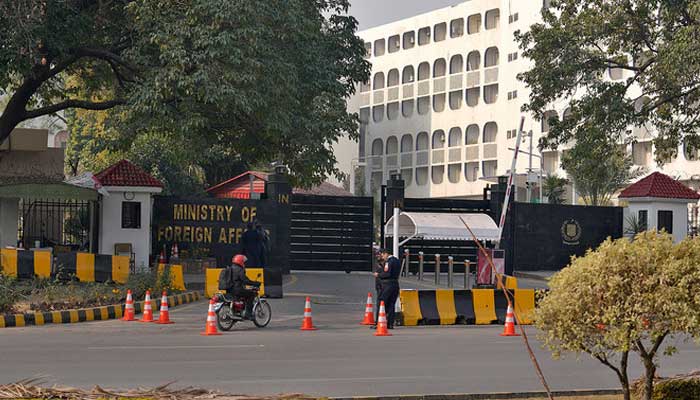 Police officers stand guard at the main entry gate of the Ministry of Foreign Affairs in Islamabad on January 18, 2024. — AFP