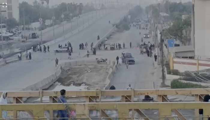 Residents protest after a three-year-old boy falls into open manhole in Karachi on November 30, 2025. — Screengrab via Geo News