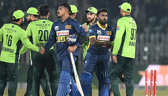 Sri Lankas Maheesh Theekshana (centre left) and Sri Lankas Asitha Fernando (centre right) shake hands with Pakistans players at the end of the first ODI cricket match between Pakistan and Sri Lanka at the Rawalpindi Cricket Stadium, November 11, 2025. — AFP