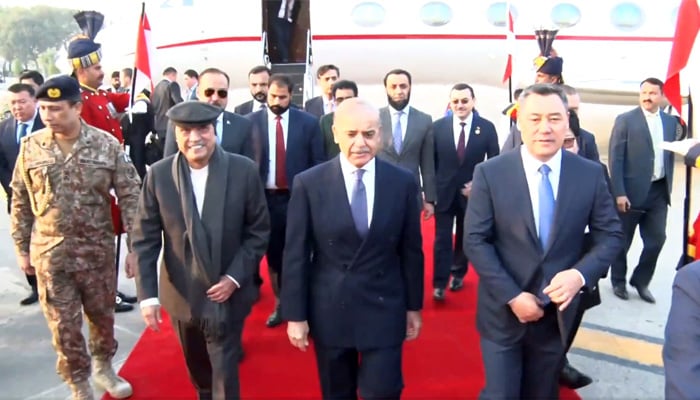 Prime Minister Shehbaz Sharif and President Asif Ali Zardari weclome Kyrgyzstans President Sadyr Nurgozhoevich Zhaparov upon arrival in Islamabad, December 3, 2025. — Screengrab via YouTube/Geo News