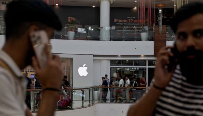 People wait in a queue outside an Apple retail store, as the iPhone 17 series goes on sale, in New Delhi, India, September 19, 2025. — Reuters