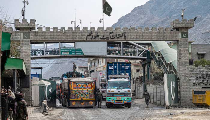 Afghan cargo trucks enter Pakistan at the Afghanistan-Pakistan Torkham border post on February 2, 2023. — AFP